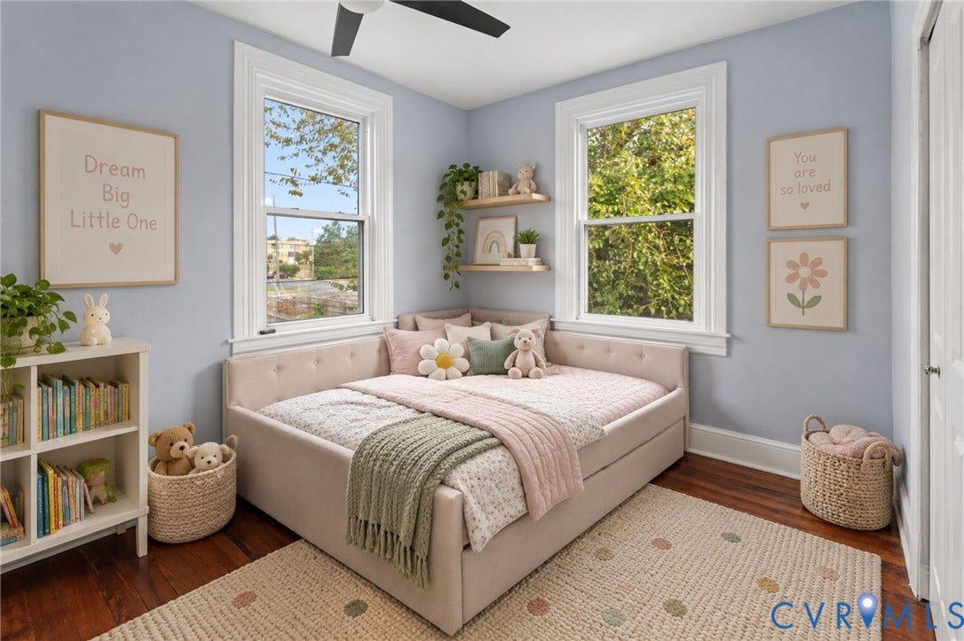 724 N 1st Street, Jackson Ward, Richmond, VA 23219 Hardwood flooring, two single-hung windows with white trim, built-in shelving, and a ceiling fan with integrated lighting