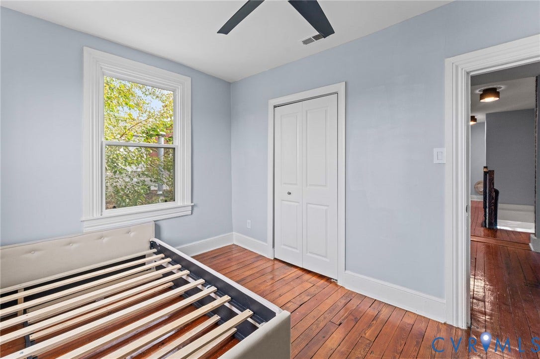 724 N 1st Street, Jackson Ward, Richmond, VA 23219 Wood-finish flooring throughout, white trim, and a ceiling fan
