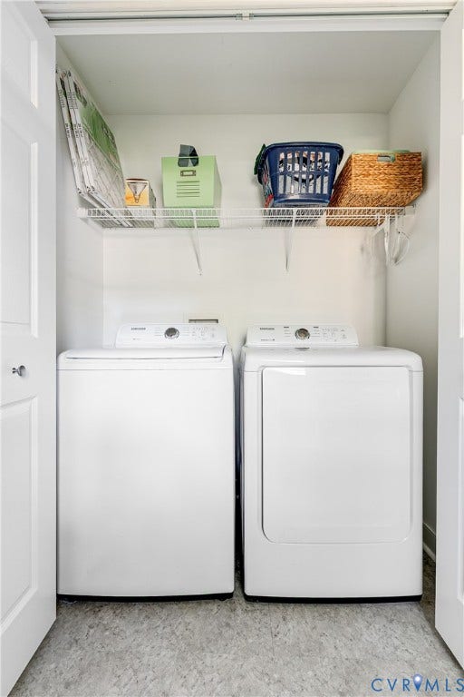 Laundry closet with white bi-fold doors, equipped with a top-load washing machine and front-load dryer, featuring a wire storage shelf, and light-toned flooring