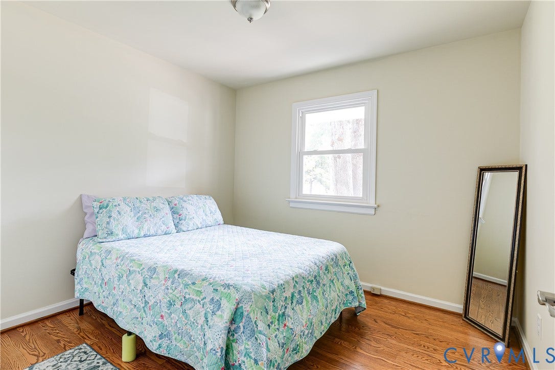 Light-toned wall finishes complemented by wood-finish flooring