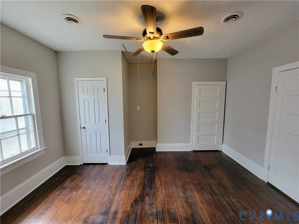 1223 Paul Street, Hillcrest, Petersburg, VA 23803 Hardwood flooring, crisp white trim, ceiling fan with integrated lighting, and multiple panel doors