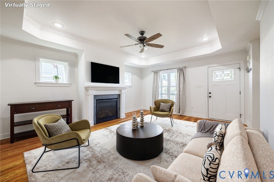 2902 Lawson Street, Richmond, VA 23224 Tray ceiling with recessed lighting, fireplace with a classic mantel, wood-finish flooring, and exterior door with decorative glass panel