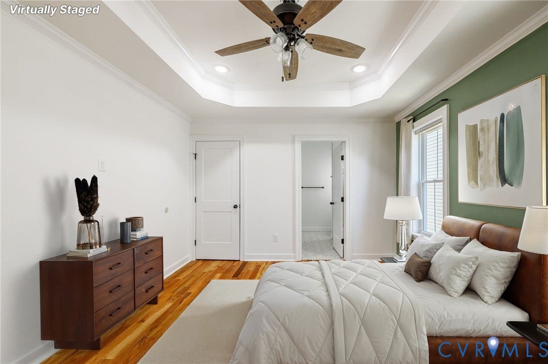 2902 Lawson Street, Richmond, VA 23224 Tray ceiling featuring a central multi-blade ceiling fan, wood-finish flooring, and crown molding