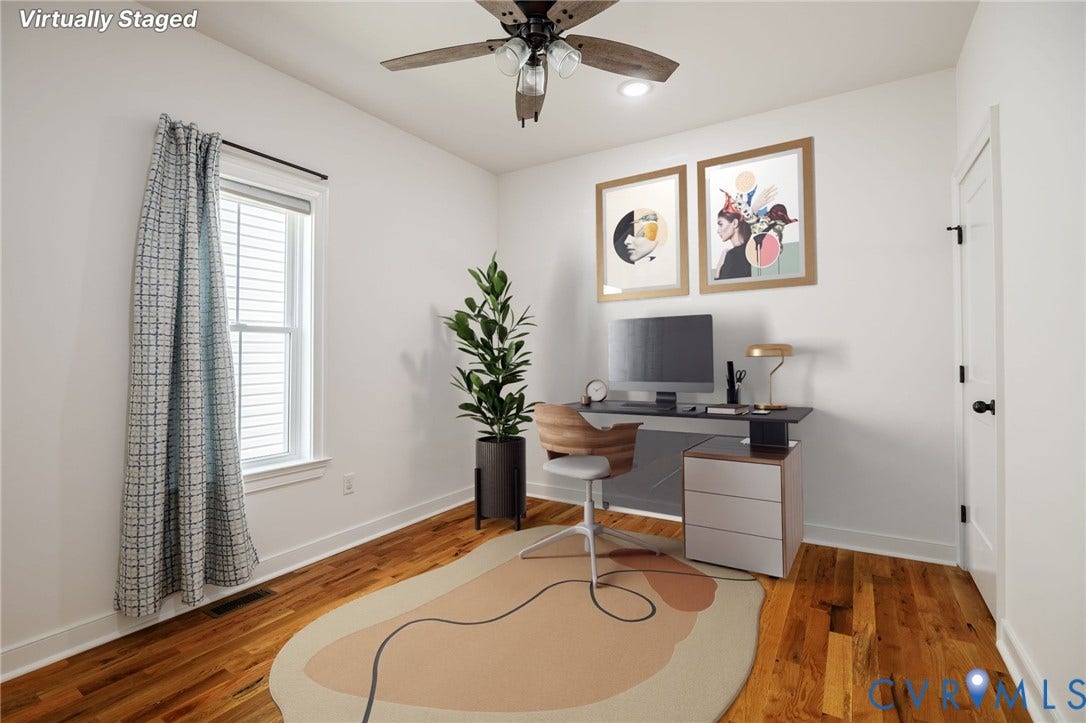 2902 Lawson Street, Richmond, VA 23224 Room featuring wood-finish flooring, a multi-blade ceiling fan with integrated lighting, and a window with white trim