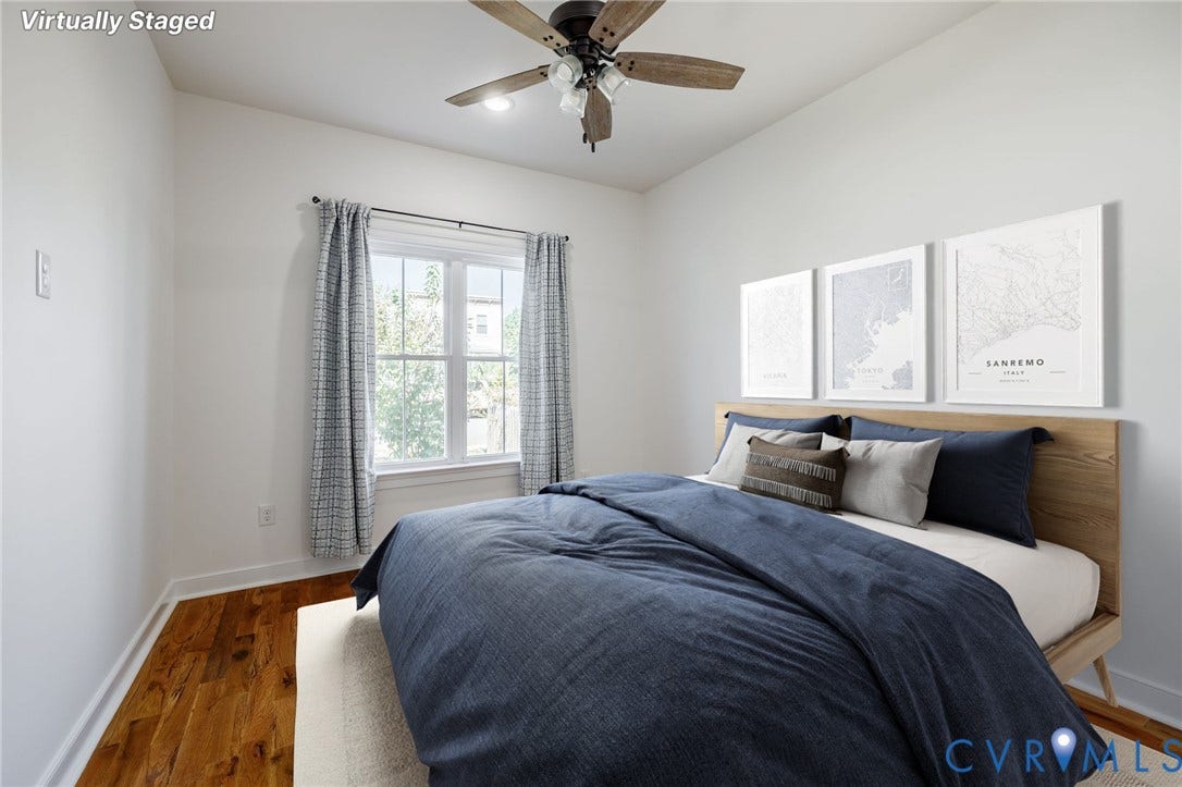 2902 Lawson Street, Richmond, VA 23224 Wood-finish flooring, multi-pane window with white trim, and ceiling fan with integrated lighting