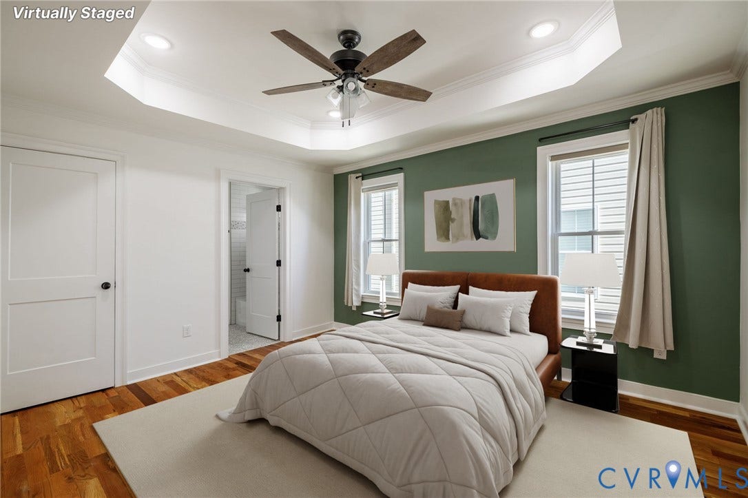 2902 Lawson Street, Richmond, VA 23224 Tray ceiling with recessed lighting, wood-finish flooring, and a five-blade ceiling fan with integrated light fixture