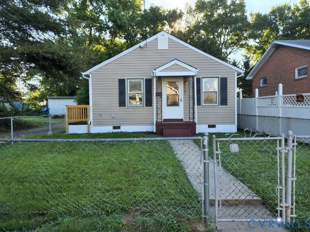 Single-story residence featuring light-colored siding, dark window shutters, and a covered entry porch