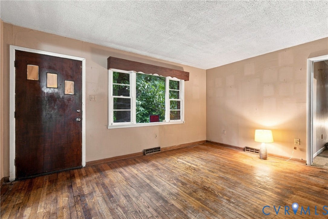 8150 Bradbury Road, Henrico, VA 23231 Wood-finish flooring with a textured ceiling