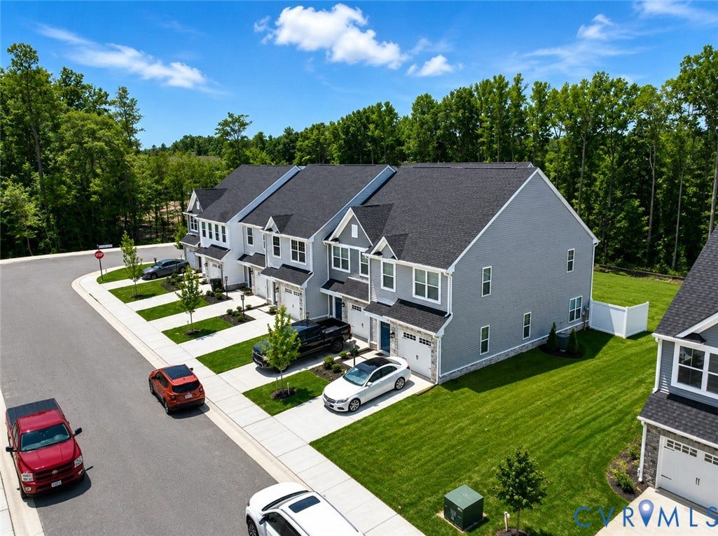 10607 Pink Lilly Lane, Chester, VA 23831 Townhome exteriors with gray siding, white trim, and dark shingle roofs