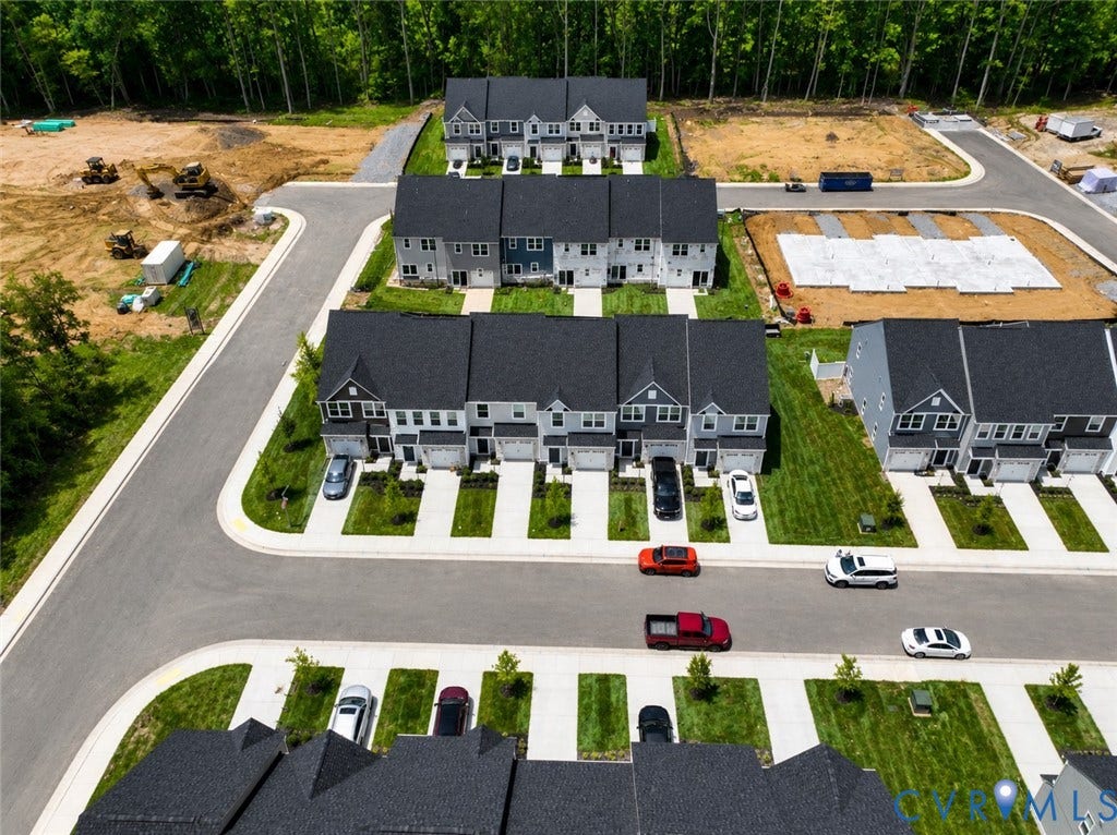 10607 Pink Lilly Lane, Chester, VA 23831 Newly constructed residential community featuring multi-story homes with dark shingle roofs and light-toned siding