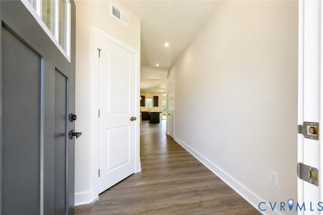 10607 Pink Lilly Lane, Chester, VA 23831 Entryway featuring a dark paneled door with transom windows, wood-finish flooring, and recessed lighting