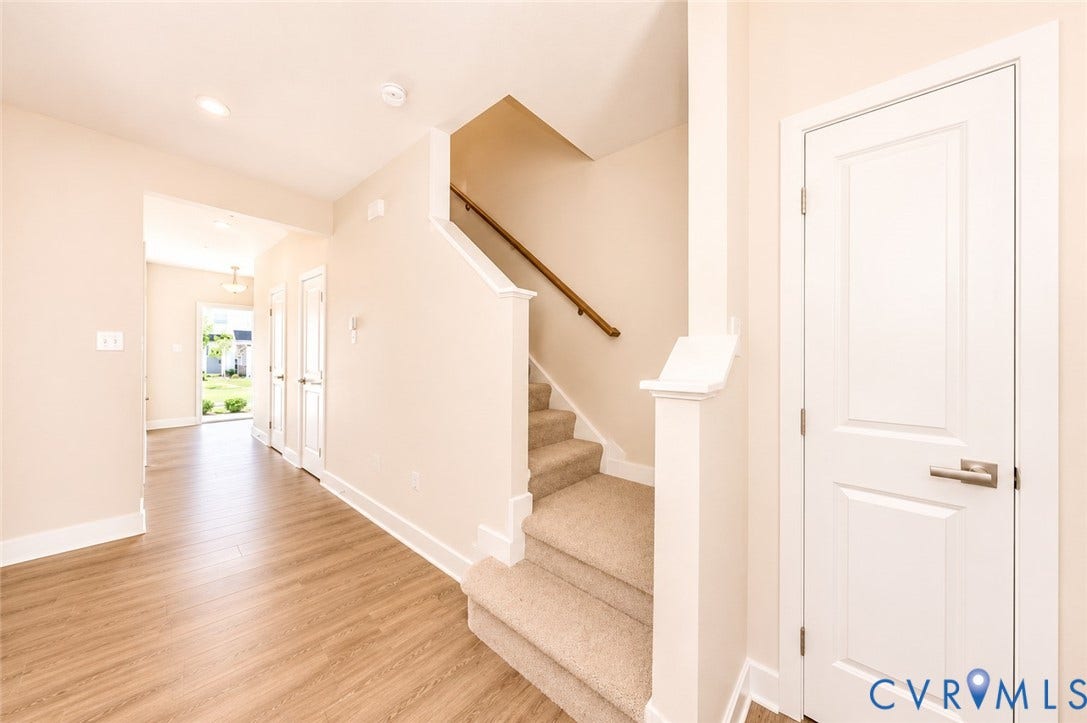 10607 Pink Lilly Lane, Chester, VA 23831 Wood-finish flooring, recessed lighting, carpeted staircase with wood handrail, white interior doors