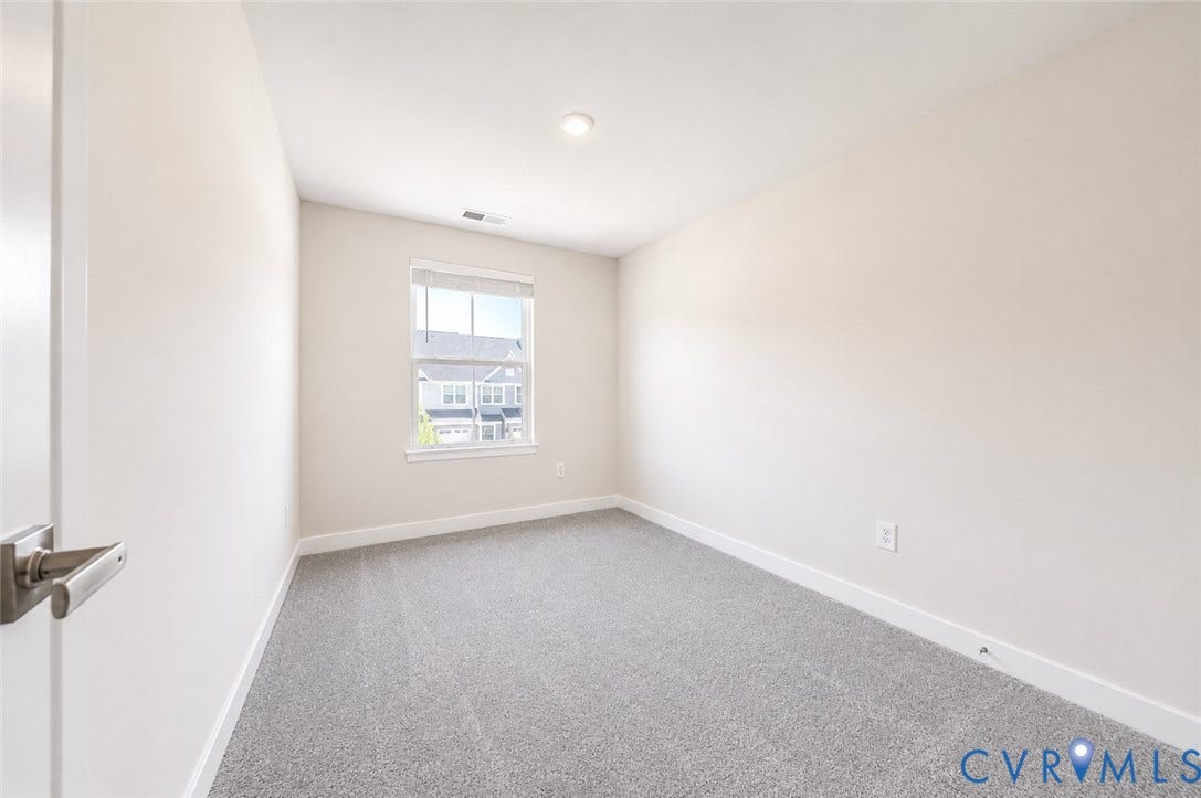 10607 Pink Lilly Lane, Chester, VA 23831 Recessed ceiling lighting, window with blinds, light-colored walls, gray carpet, and white trim