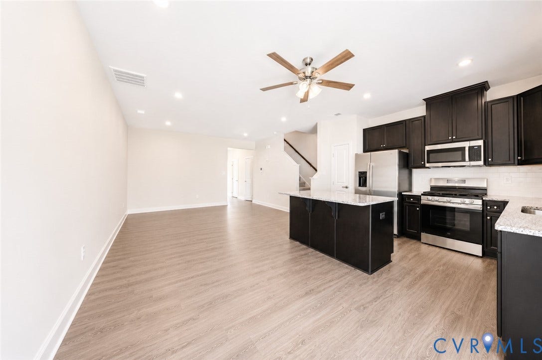 10607 Pink Lilly Lane, Chester, VA 23831 Open-concept living area featuring wood-finish flooring, recessed lighting, and a ceiling fan