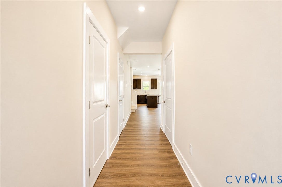 10607 Pink Lilly Lane, Chester, VA 23831 Hallway featuring wood-finish flooring, recessed lighting, and crisp white trim