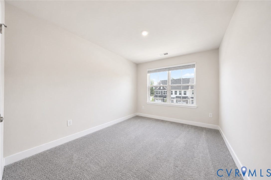 10607 Pink Lilly Lane, Chester, VA 23831 Neutral wall paint, recessed lighting, double-hung window, and gray carpeting