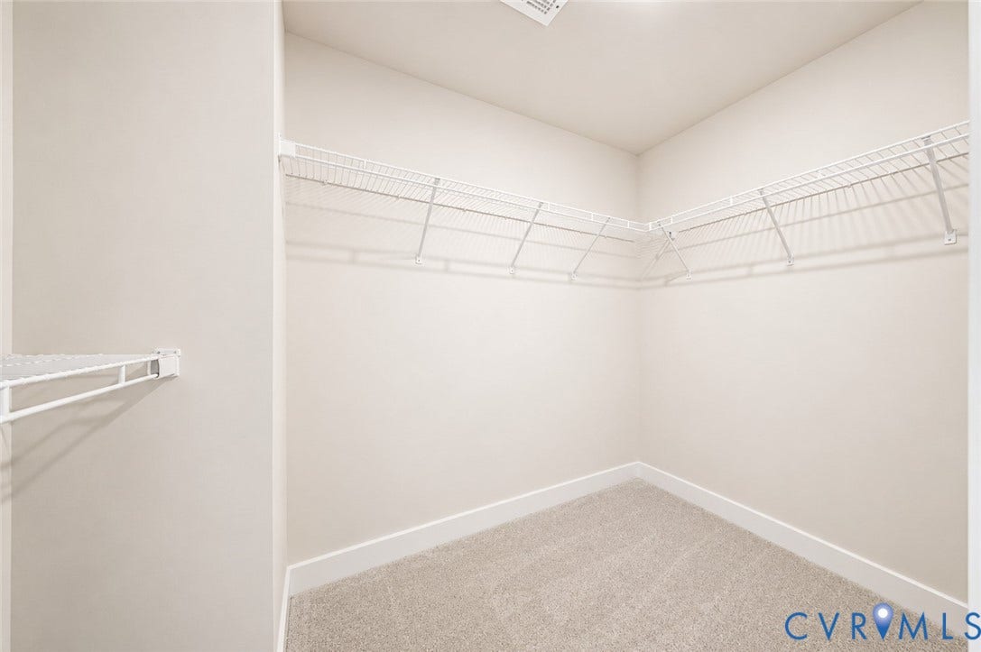 10607 Pink Lilly Lane, Chester, VA 23831 Corner wire shelving system, light-toned carpet, and white walls