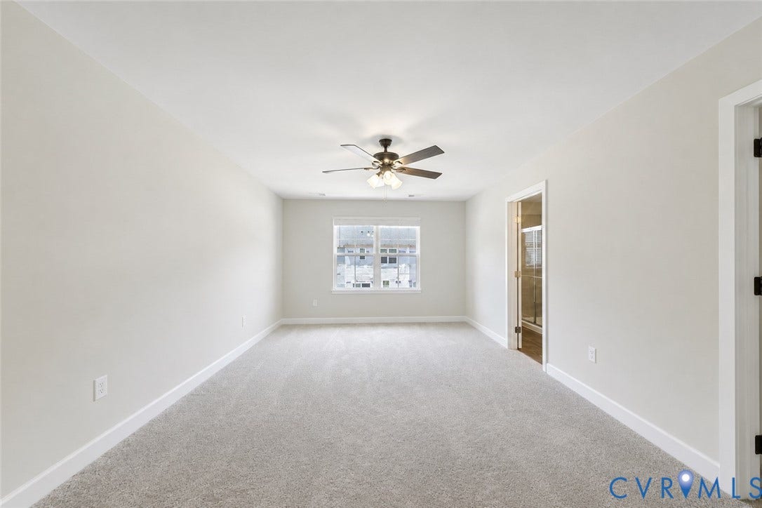 10607 Pink Lilly Lane, Chester, VA 23831 Neutral-toned walls complement the light grey carpeting