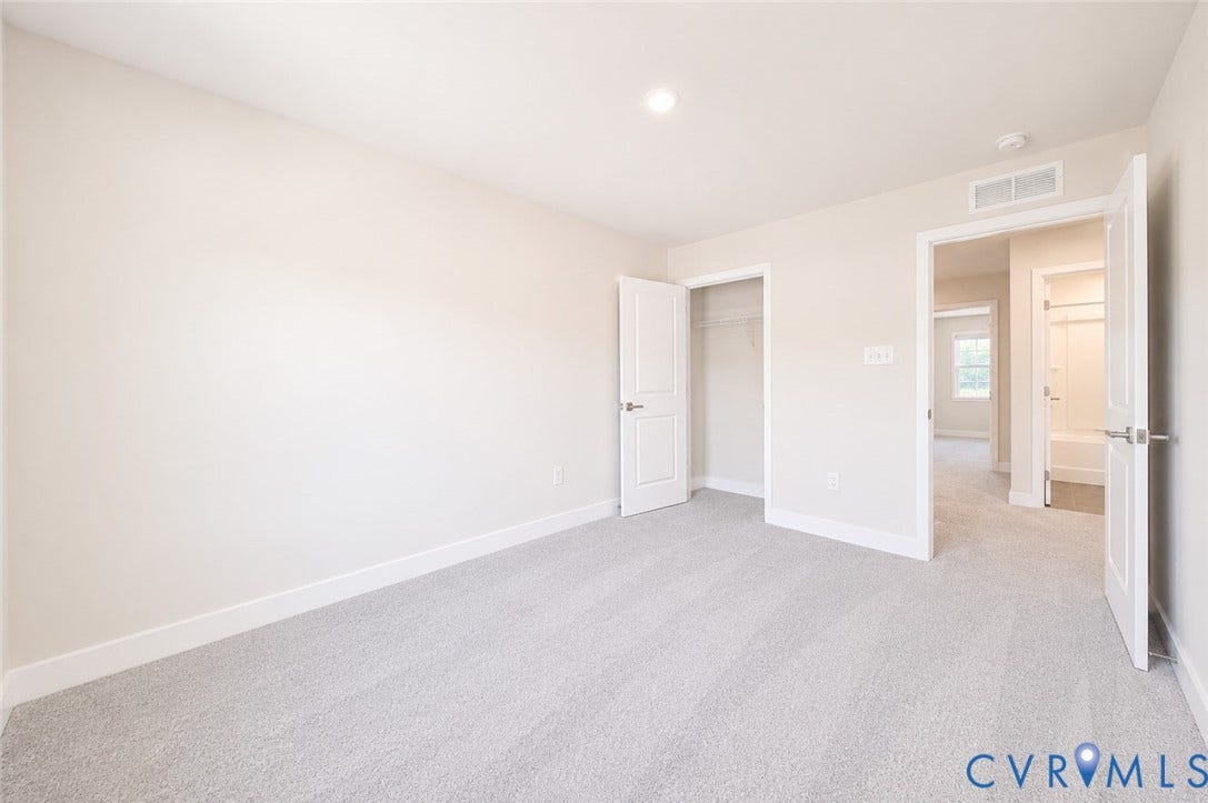 10607 Pink Lilly Lane, Chester, VA 23831 Neutral wall paint, light gray carpeting, recessed ceiling lighting, white trim, and a white interior door