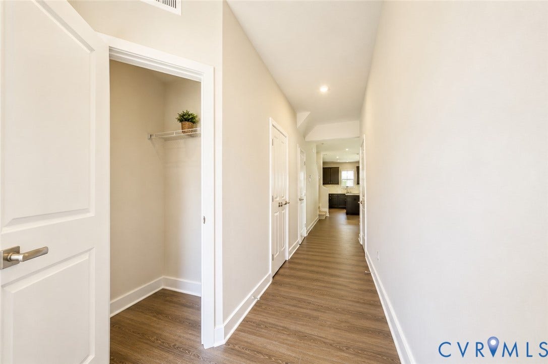 10607 Pink Lilly Lane, Chester, VA 23831 Hallway featuring wood-finish flooring, recessed lighting, and a closet with wire shelving