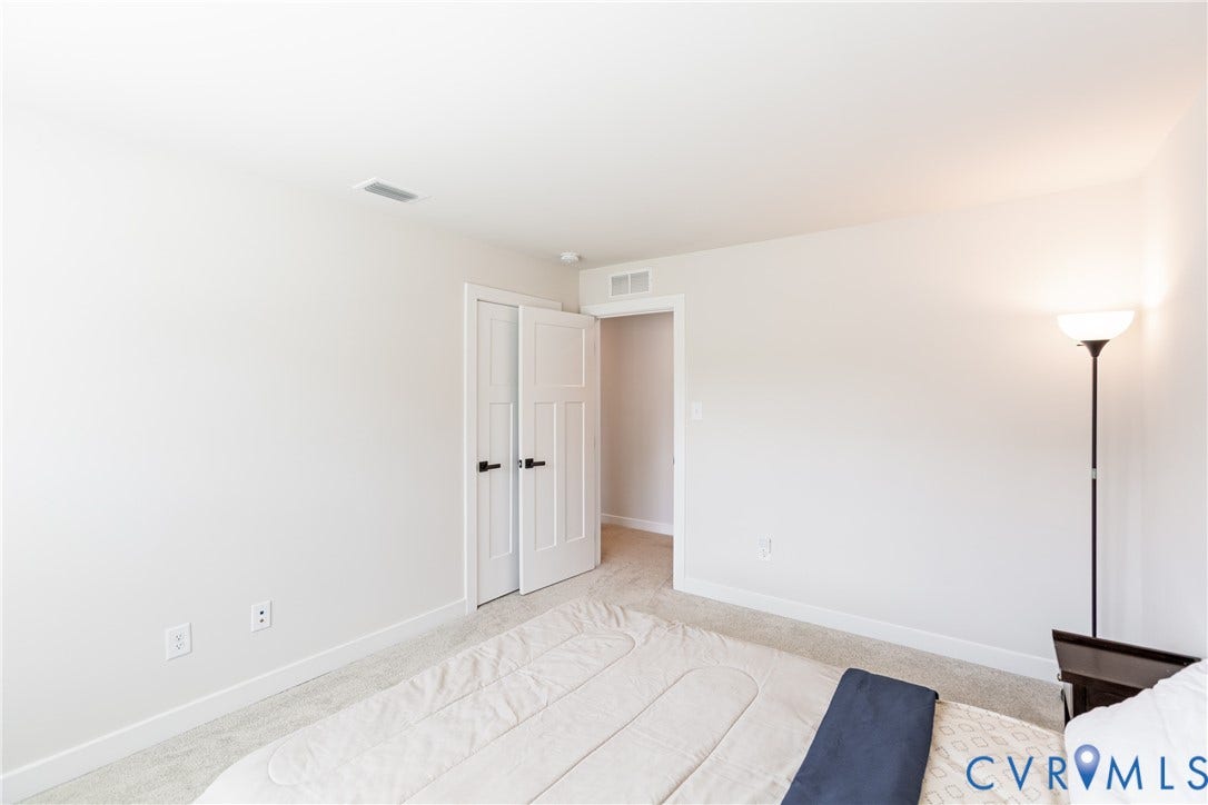 1943 Enon Station Drive, Chester, VA 23836 Light-colored wall finishes, white trim, and light-toned carpeting