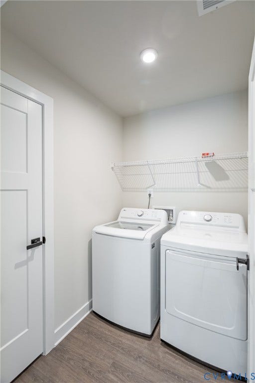 1943 Enon Station Drive, Chester, VA 23836 Laundry area featuring wood-finish flooring, recessed lighting, and a wire storage shelf