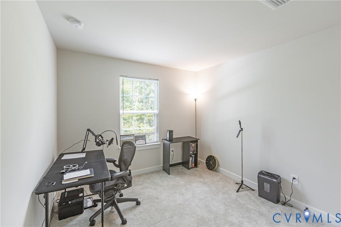 1943 Enon Station Drive, Chester, VA 23836 Neutral color palette, window with exterior greenery, light-toned carpet, recessed ceiling vent, and a smoke detector