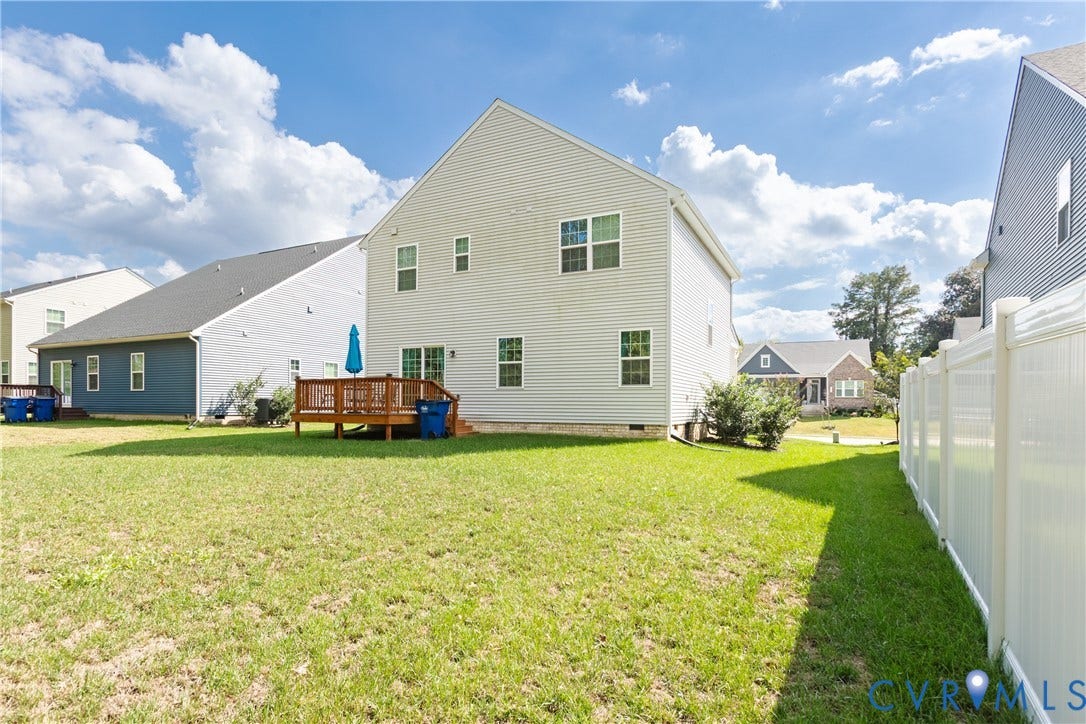 1943 Enon Station Drive, Chester, VA 23836 Expansive green space featuring a wood deck and privacy fencing