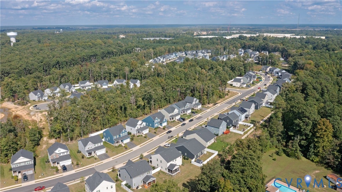 1943 Enon Station Drive, Chester, VA 23836 Residential community with paved roadways surrounded by mature trees