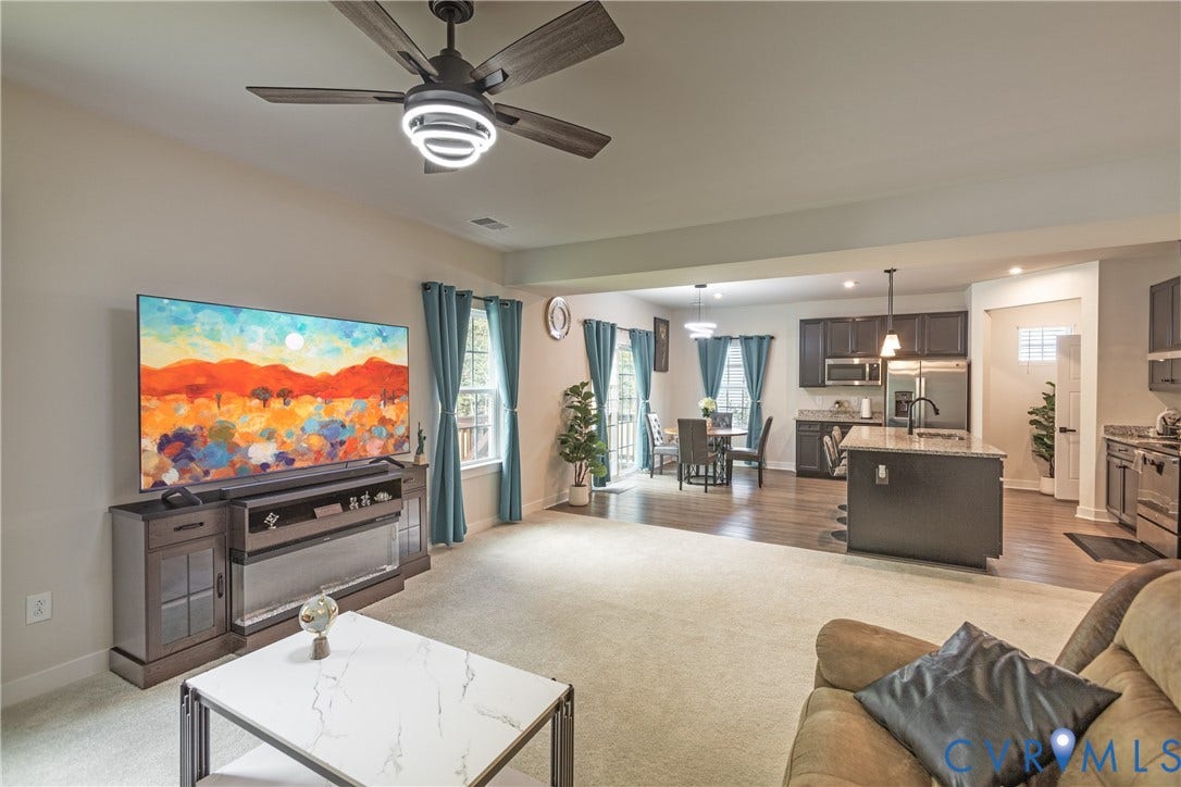 1943 Enon Station Drive, Chester, VA 23836 Spacious living area with ceiling fan, recessed lighting, and wall-to-wall carpeting