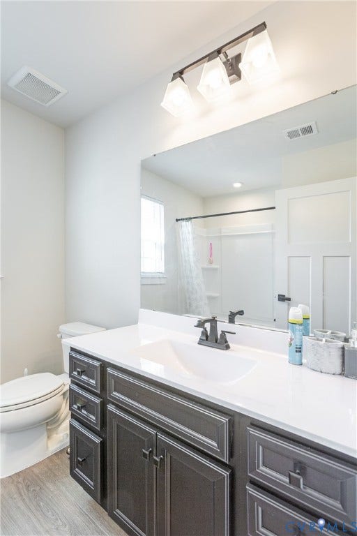 1943 Enon Station Drive, Chester, VA 23836 Extended vanity with a white countertop and dark cabinetry