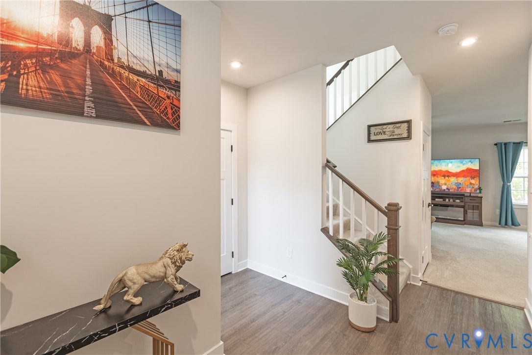 1943 Enon Station Drive, Chester, VA 23836 Entryway featuring wood-finish flooring, a staircase with white risers and wood handrails, and recessed lighting