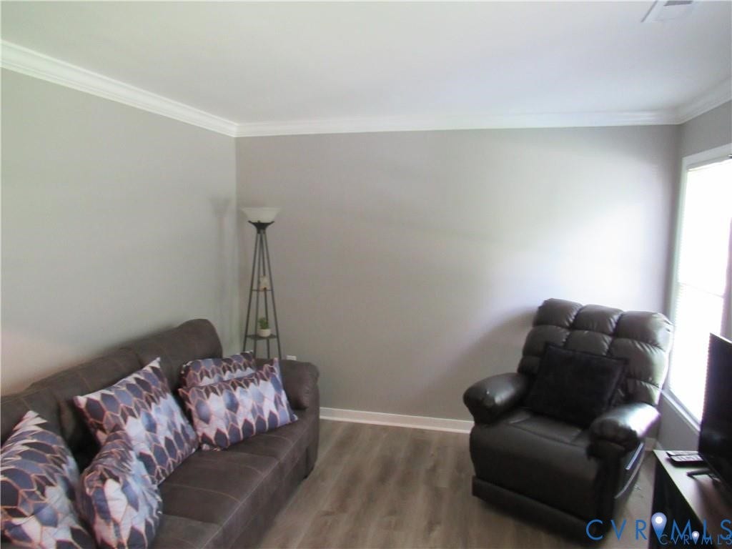 8506 Lyndale Drive, Chesterfield, VA 23235 Wood-finish flooring with light gray walls and white crown molding
