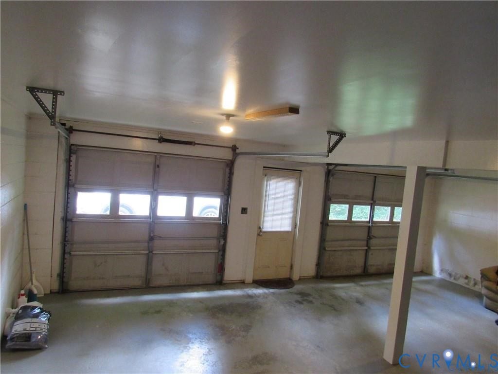 8506 Lyndale Drive, Chesterfield, VA 23235 Finished garage space with two overhead doors and an additional entry door