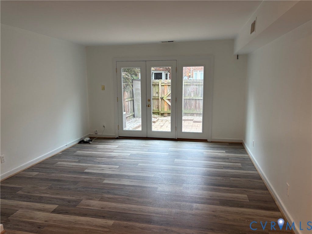 305 N Hamilton Street, #C, Richmond, VA 23221 Living room with new luxury vinyl plank flooring, white walls, and bright white trim