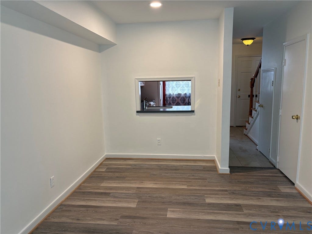 305 N Hamilton Street, #C, Richmond, VA 23221 Dining area with new luxury vinyl plank flooring, white wall paint, recessed lighting, and a pass-through window