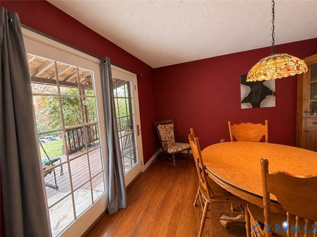 Wood-finish flooring with a deep red wall color