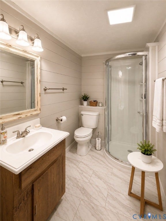 Wood-finish vanity with an integrated sink, polished chrome faucet, and rectangular mirror