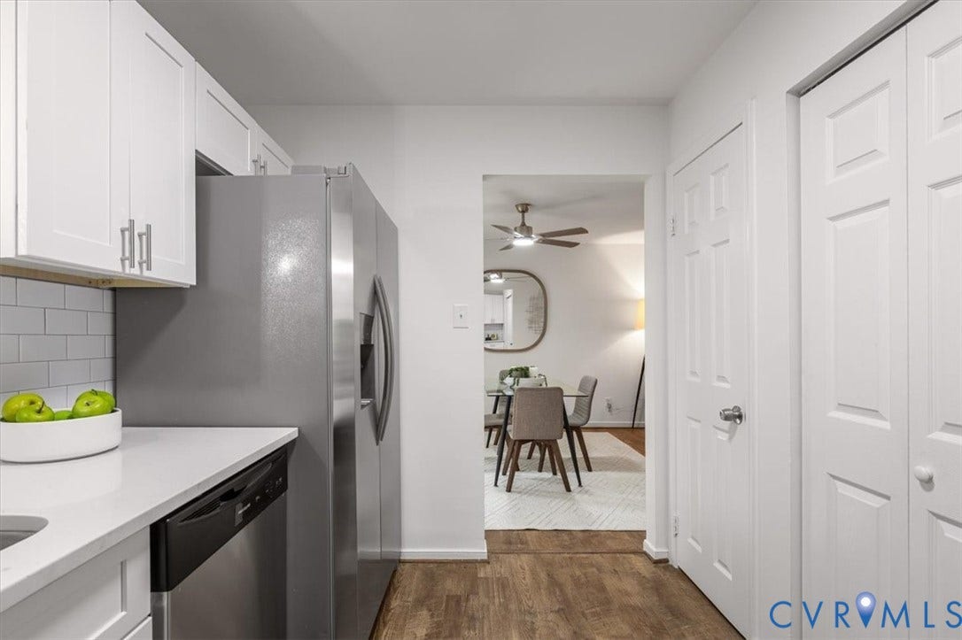 3031 Speeks Drive, Midlothian, VA 23112 Kitchen featuring white cabinetry, stainless steel refrigerator, integrated dishwasher, and wood-finish flooring