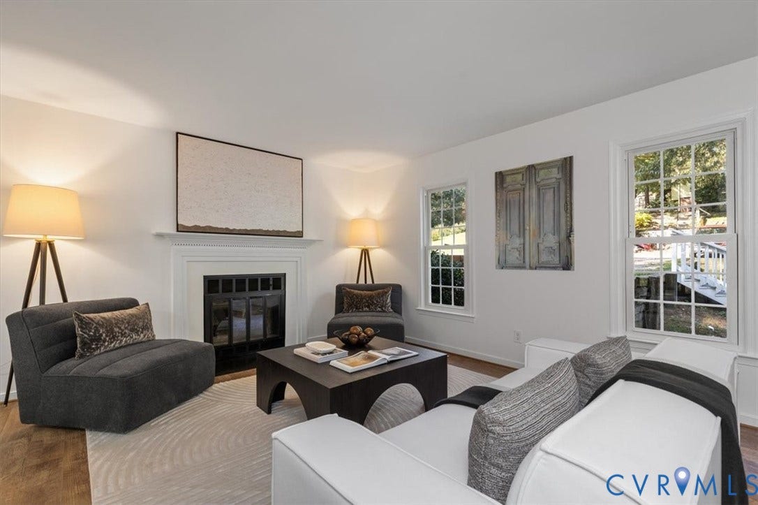 3031 Speeks Drive, Midlothian, VA 23112 Wood-finish flooring, white walls, and a fireplace with a white mantel and black firebox