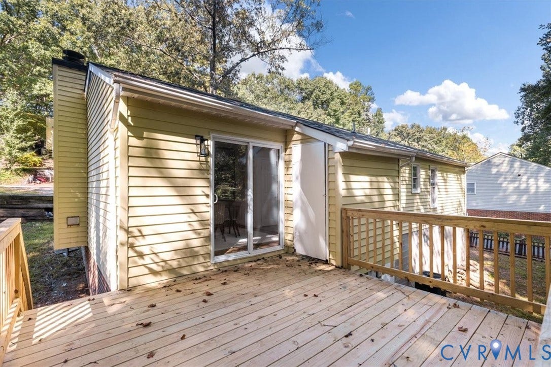 3031 Speeks Drive, Midlothian, VA 23112 Spacious wood deck with a natural finish, wood railing, and direct access through a glass sliding door
