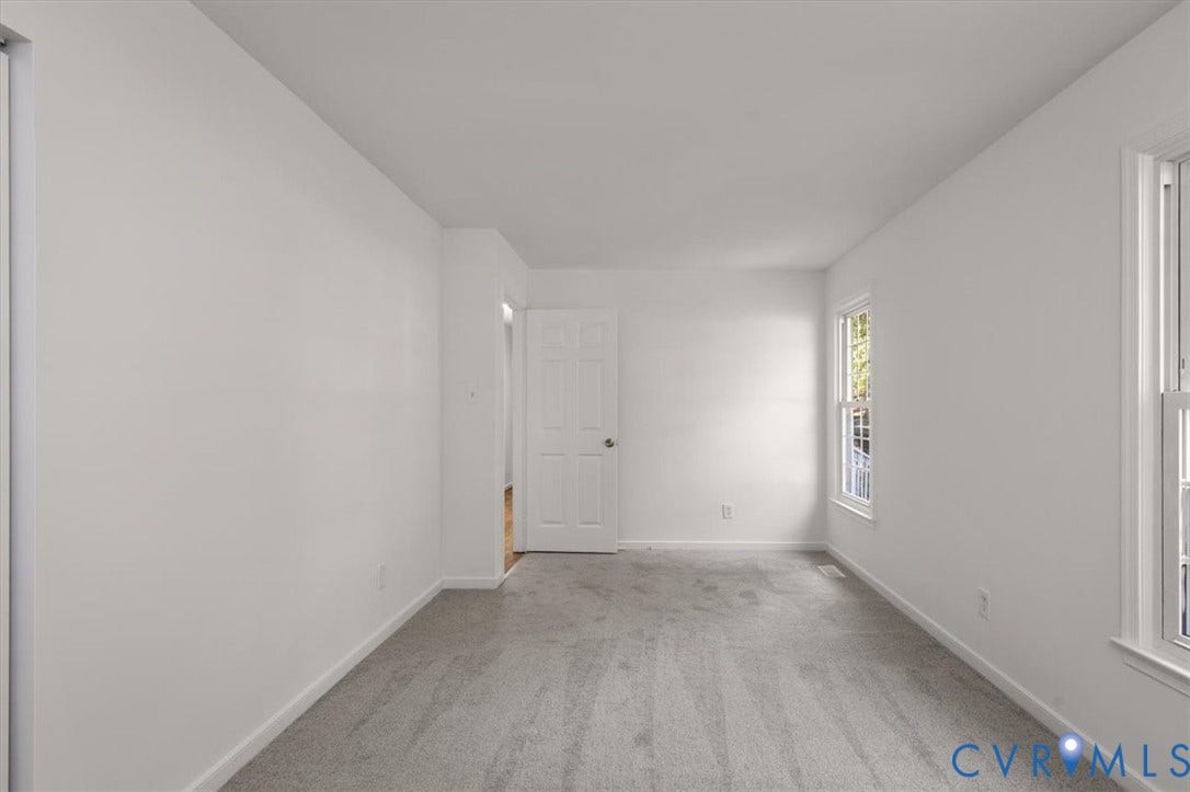 3031 Speeks Drive, Midlothian, VA 23112 White walls, light gray carpet, and two double-hung windows