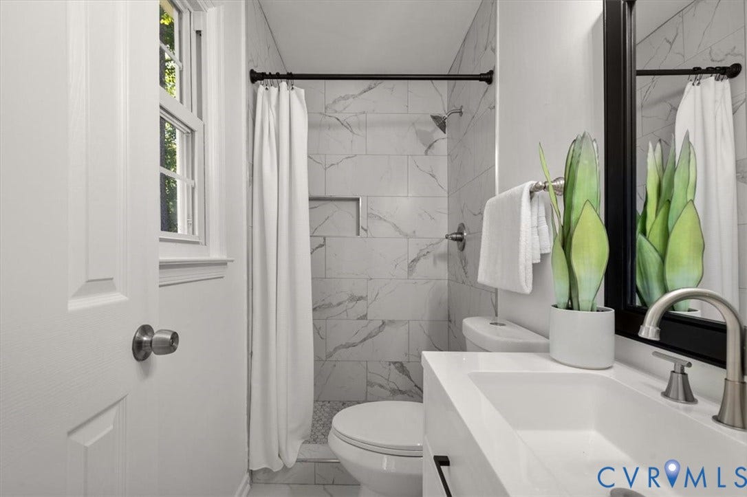 3031 Speeks Drive, Midlothian, VA 23112 White vanity with an integrated sink and brushed nickel faucet