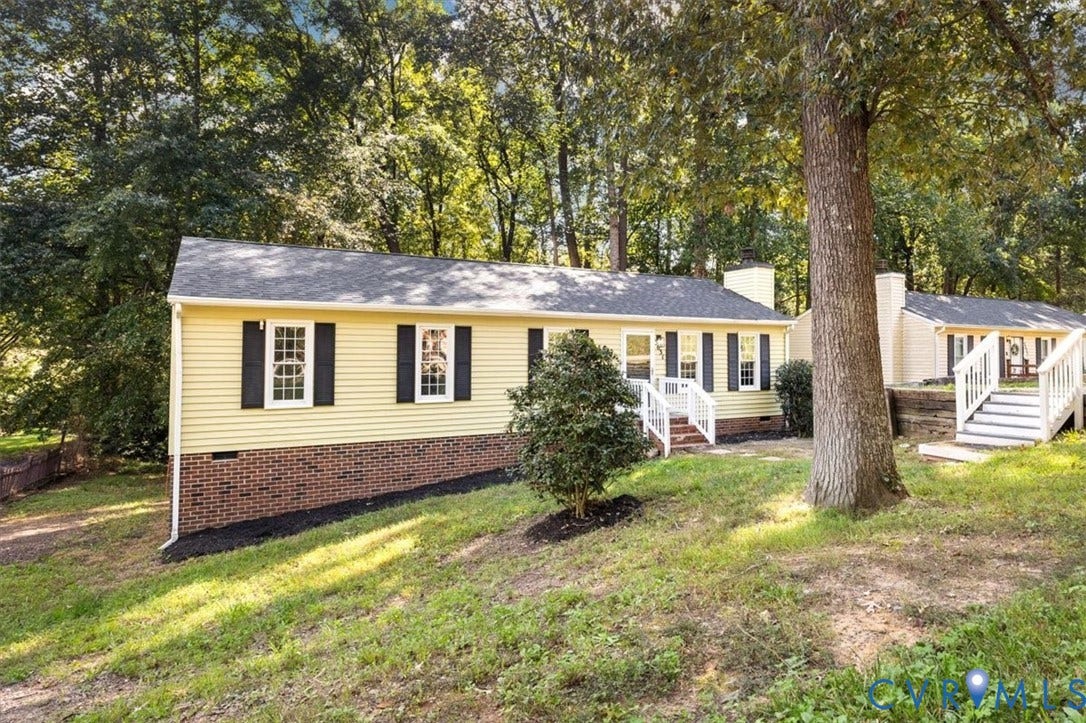 3031 Speeks Drive, Midlothian, VA 23112 Exterior featuring light yellow siding, brick foundation, white trim, and a shingled roof