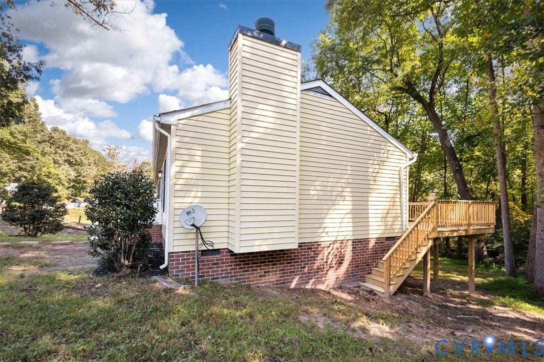 3031 Speeks Drive, Midlothian, VA 23112 Exterior featuring horizontal siding, brick foundation, a chimney, and a wooden deck with stairs