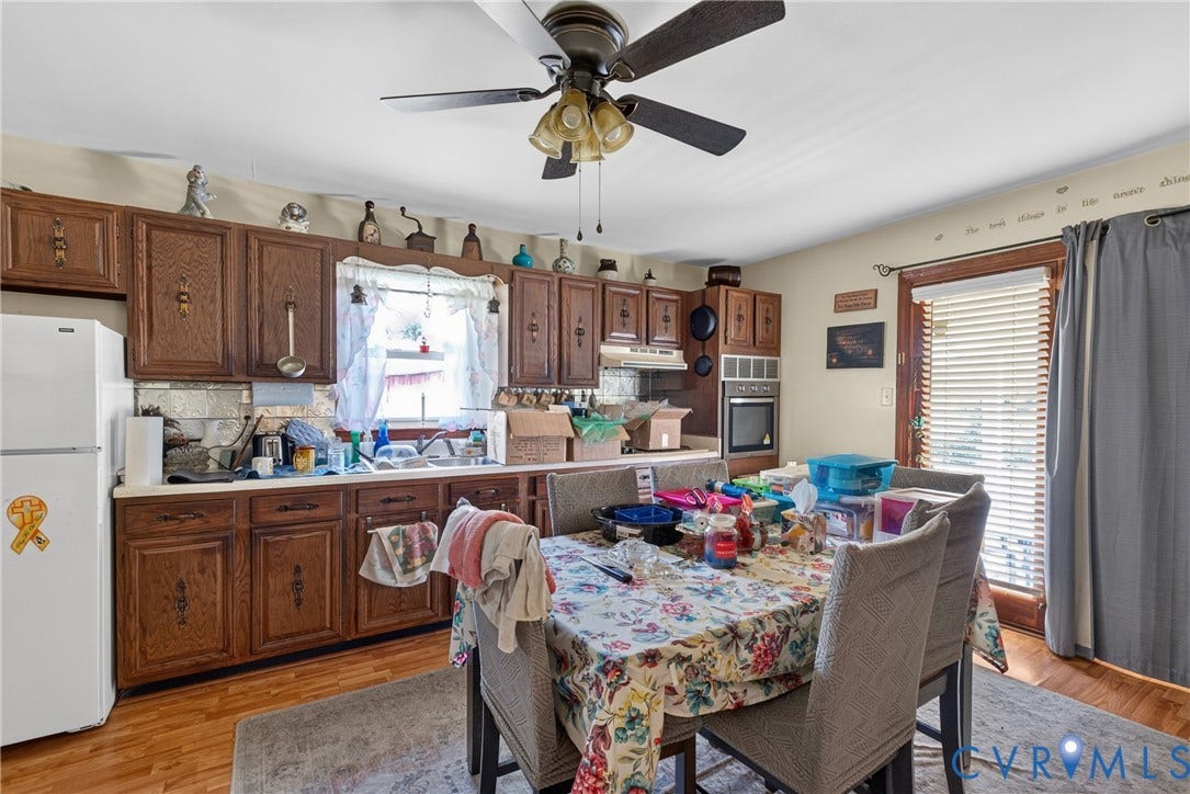 117 Gardners Road, Cross County Area, Mineral, VA 23117 Kitchen featuring wood-finish cabinetry, built-in wall oven, and a ceiling fan with integrated lighting
