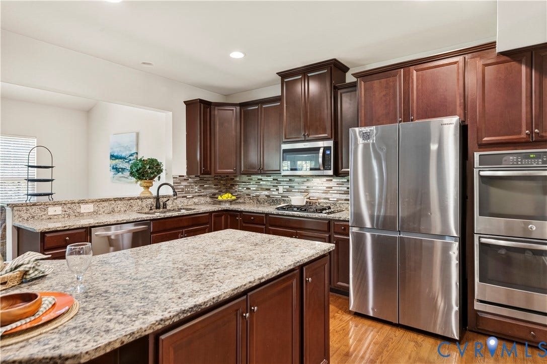 10041 POLLEN Drive, Hanover, Mechanicsville, VA 23116 A Kitchen Island that provides a Great Workspace without missing out on all the First Floor Action!