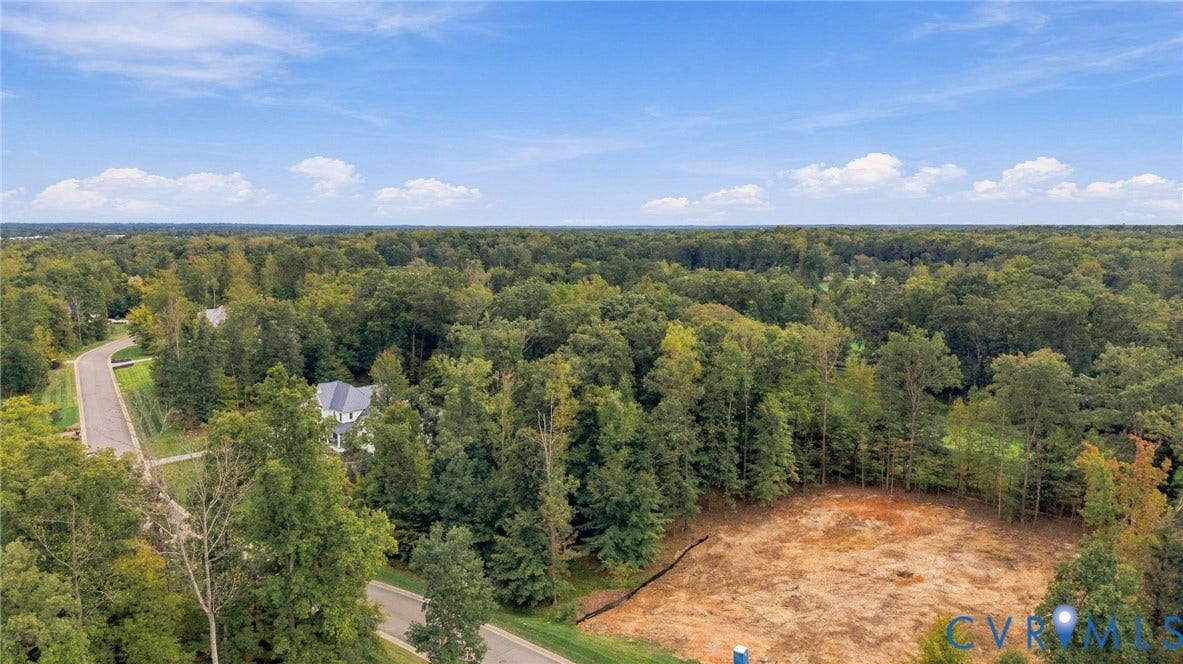 923 Kinloch Point Lane, Kinloch, Manakin Sabot, VA 23103 Expansive wooded landscape with a partially cleared building site and paved roadways