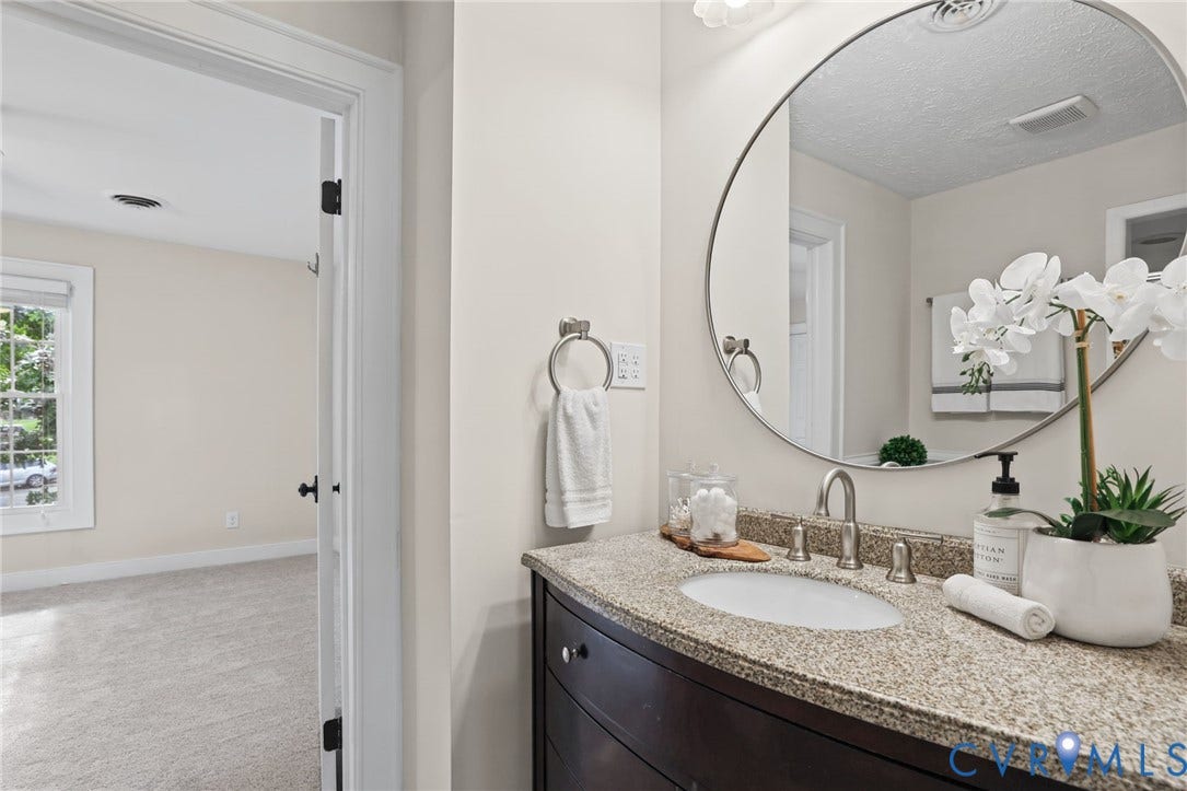 Jack and Jill bathroom shared by the two additional bedrooms.