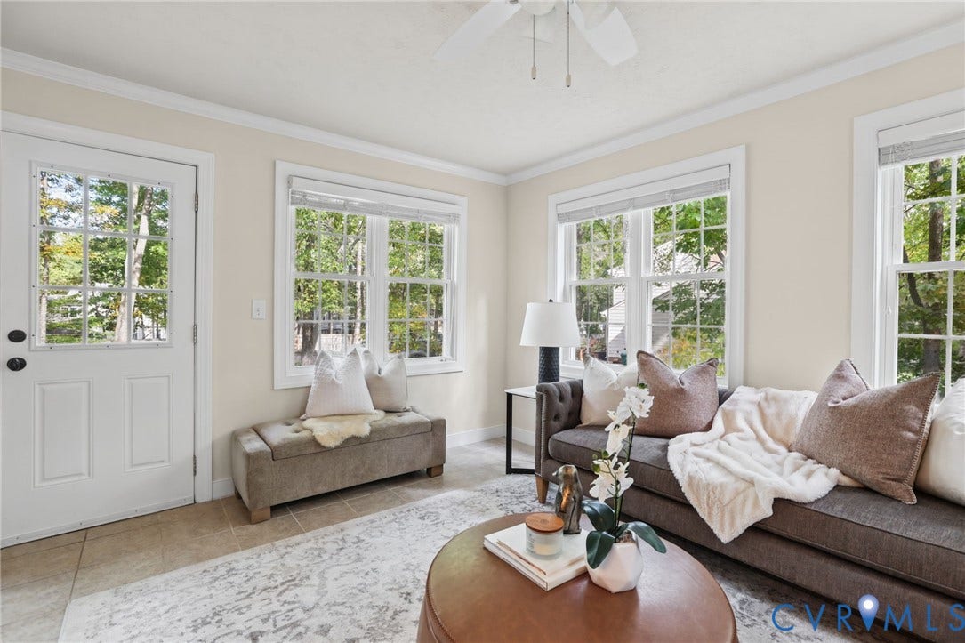 This light and bright sun room is right off of the kitchen and provides access to the outdoor patio.